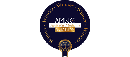 深藍色圓形獎項徽章，金色外圈圍繞 Winner 字樣，中央為 AMWC Aesthetic Medicine AWARDS 及金色 1 字獎牌